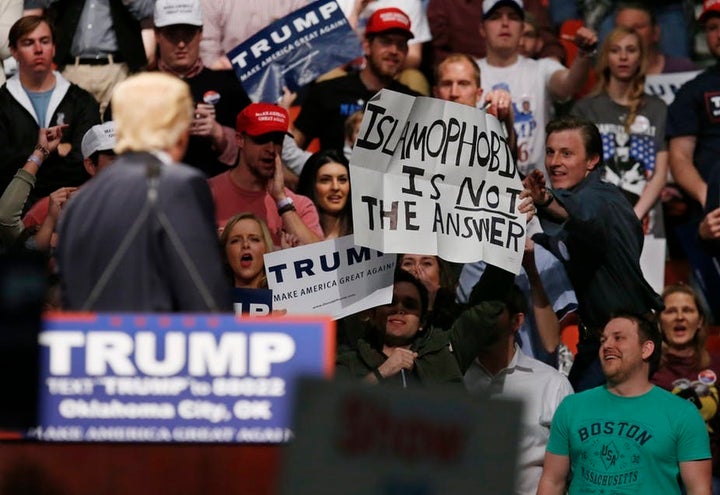 At a 2016 Trump rally, a man holds up a sign, ‘Islamophobia is not the answer.’