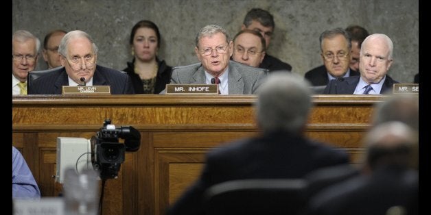 Senate Armed Services Committee ranking member Sen. James Inhofe, R-Okla., second from left, asks a question of former Nebraska Sen. Chuck Hagel, second from right, President Barack Obama's choice for defense secretary, on Capitol Hill in Washington, Thursday, Jan. 31, 2013, during the Senate Armed Services Committee hearing on his nomination. Senate Armed Services Committee Chairman Carl Levin, D-Mich., left, and Sen. John McCain, R-Ariz., right, listen. (AP Photo/Susan Walsh)