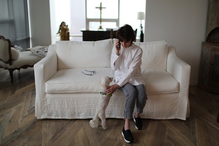 Laura Pontikes talks on the phone in her apartment in Houston on April 13, 2019. 