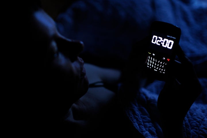 A woman checks the time on her smartphone on March 23, 2013, in Angers, western France. The transition to summer time will take place on the night of March 31 to April 1 in France and in other European countries, when watches and clocks will be changed from 2h00 to 3h00 in the morning. AFP PHOTO / JEAN-SEBASTIEN EVRARD (Photo credit should read JEAN-SEBASTIEN EVRARD/AFP/Getty Images)