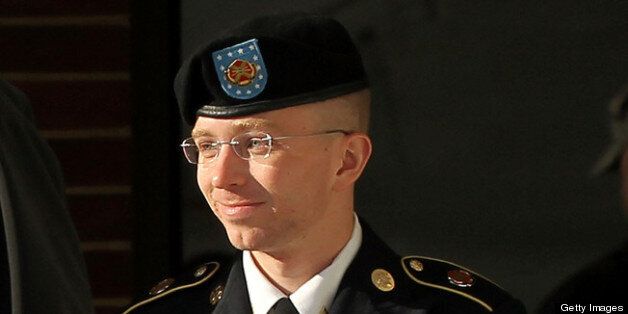 FORT MEADE, MD - OCTOBER 17: U.S. Army private first class Bradley Manning is escorted away after a hearing on the witness list of a speedy trial motion October 17, 2012 at Fort Meade in Maryland. Manning is charged with aiding the enemy and transmitting defense records, plus other counts, after he was accused of passing classified documents to the whistleblower website WikiLeaks. (Photo by Alex Wong/Getty Images)