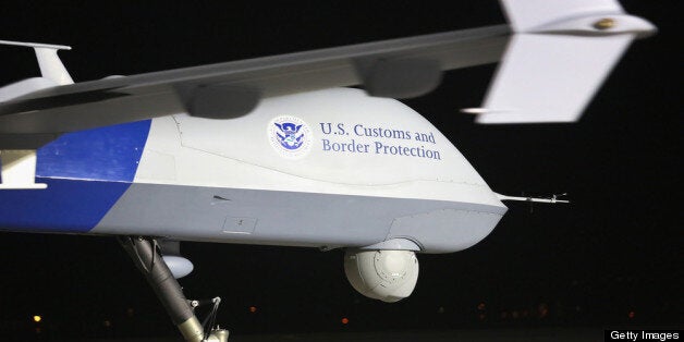 SIERRA VISTA, AZ - MARCH 07: A Predator drone operated by U.S. Office of Air and Marine (OAM), taxis towards the tarmac for a surveillance flight near the Mexican border on March 7, 2013 from Fort Huachuca in Sierra Vista, Arizona. The OAM, which is part of U.S. Customs and Border Protection, flies the unmanned - and unarmed - MQ-9 Predator B aircraft an average of 12 hours per day at around 19,000 feet. The drones, piloted from the ground, search for drug smugglers and immigrants crossing illegally from Mexico into the United States. (Photo by John Moore/Getty Images)