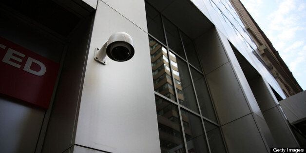 NEW YORK, NY - APRIL 24: A surveillance camera is attached to a building along a street in the Financial District on April 24, 2013 in New York City. Following the twin bombings at the Boston Marathon, a new focus has been placed on surveillance cameras, which have become common in most metropolitan centers across America. The FBI used footage from surveillance cameras to identify the bombing suspects, which eventually led to their capture. Despite the security role of the cameras in law enforcement, numerous civic groups and privacy advocates are still opposed to the use of surveillance cameras in public spaces. (Photo by Spencer Platt/Getty Images)