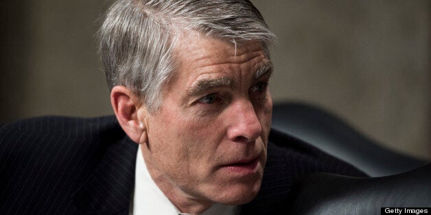 UNITED STATES - NOVEMBER 15: Sen. Mark Udall, D-Colo., speaks with fellow committee members before the start of the Senate Armed Services Committee confirmation hearing on Marine Corps Gen. Joseph Dunford Jr., nomination for reappointment to the grade of general and to be commander of the International Security Assistance Force, and to be commander of U.S. Forces, Afghanistan, on Thursday, Nov. 15, 2012. (Photo By Bill Clark/CQ Roll Call)