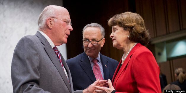UNITED STATES - MAY 20: Chairman Pat Leahy, D-Vt., left, Sens. Chuck Schumer, D-N.Y., and Dianne Feinstein, D-Calif., talk before a Senate Judiciary Committee markup session in Hart Building for the 'Border Security, Economic Opportunity, and Immigration Modernization Act,' which they hope to finish this week and bring to the floor in June. (Photo By Tom Williams/CQ Roll Call)