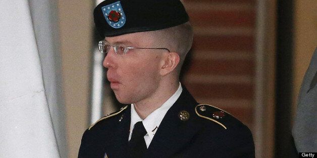 WASHINGTON, DC - JANUARY 08: Pfc. Bradley E. Manning is escorted from a hearing, on January 8, 2013 in Fort Meade, Maryland. Manning attended a motion hearing in the case of United States vs. Pfc. Bradley E. Manning, who is charged with aiding the enemy and wrongfully causing intelligence to be published on the internet. He is accused of sending hundreds of thousands of classified Iraq and Afghanistan war logs and more than 250,000 diplomatic cables to the website WikiLeaks while he was working as an intelligence analyst in Baghdad in 2009 and 2010. (Photo by Mark Wilson/Getty Images)