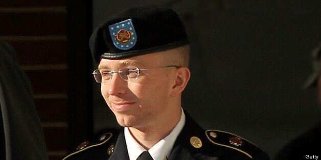 FORT MEADE, MD - OCTOBER 17: U.S. Army private first class Bradley Manning is escorted away after a hearing on the witness list of a speedy trial motion October 17, 2012 at Fort Meade in Maryland. Manning is charged with aiding the enemy and transmitting defense records, plus other counts, after he was accused of passing classified documents to the whistleblower website WikiLeaks. (Photo by Alex Wong/Getty Images)