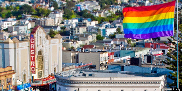 Proprietary view of the Castro neighborhood in San Francisco, CA USA. Includes the Castro rainbow flag and the Castro Theatre. Includes entrance to the Castro at the corner of Castro Street, 17th Street, and Market Streets. View of Castro plus hills above. Full daylight at 4pm spring time. Taken with a tilt shift lens. Strong colors.