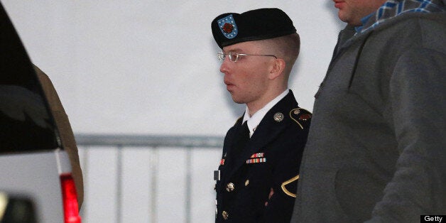 WASHINGTON, DC - JANUARY 08: Pfc. Bradley E. Manning is escorted from a hearing, on January 8, 2013 in Fort Meade, Maryland. Manning attended a motion hearing in the case of United States vs. Pfc. Bradley E. Manning, who is charged with aiding the enemy and wrongfully causing intelligence to be published on the internet. He is accused of sending hundreds of thousands of classified Iraq and Afghanistan war logs and more than 250,000 diplomatic cables to the website WikiLeaks while he was working as an intelligence analyst in Baghdad in 2009 and 2010. (Photo by Mark Wilson/Getty Images)