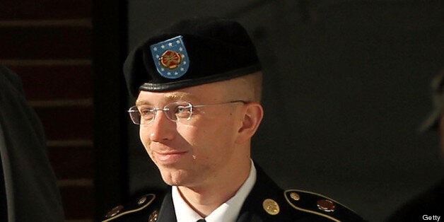 FORT MEADE, MD - OCTOBER 17: U.S. Army private first class Bradley Manning is escorted away after a hearing on the witness list of a speedy trial motion October 17, 2012 at Fort Meade in Maryland. Manning is charged with aiding the enemy and transmitting defense records, plus other counts, after he was accused of passing classified documents to the whistleblower website WikiLeaks. (Photo by Alex Wong/Getty Images)