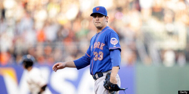SAN FRANCISCO, CA - JULY 08: Matt Harvey #33 of the New York Mets looks back at his catcher John Buck #44 after Buster Posey