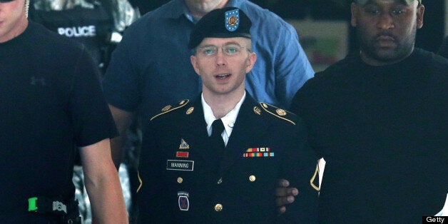 FORT MEADE, MD - JULY 30: U.S. Army Private First Class Bradley Manning (C) is escorted by military police as he leaves his military trial after he was found guilty of 20 out of 21 charges, July 30, 2013 Fort George G. Meade, Maryland. Manning, was found not guilty of aiding the enemy, was convicted of wrongfully causing intelligence to be published on the internet, is accused of sending hundreds of thousands of classified Iraq and Afghanistan war logs and more than 250,000 diplomatic cables to the website WikiLeaks while he was working as an intelligence analyst in Baghdad in 2009 and 2010. (Photo by Mark Wilson/Getty Images)