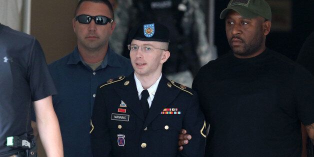 FORT MEADE, MD - JULY 30: U.S. Army Private First Class Bradley Manning is escorted by military police as he leaves his military trial after he was found guilty of 20 out of 21 charges, July 30, 2013 Fort George G. Meade, Maryland. Manning, was found not guilty of aiding the enemy, was convicted of wrongfully causing intelligence to be published on the internet, is accused of sending hundreds of thousands of classified Iraq and Afghanistan war logs and more than 250,000 diplomatic cables to the website WikiLeaks while he was working as an intelligence analyst in Baghdad in 2009 and 2010. (Photo by Mark Wilson/Getty Images)