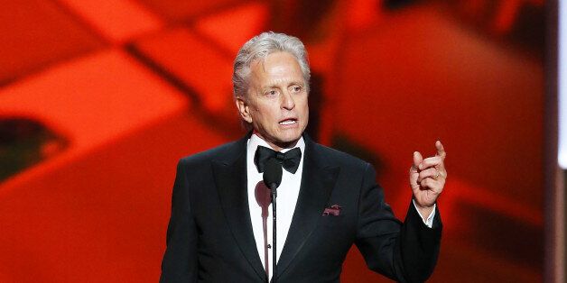 LOS ANGELES, CA - SEPTEMBER 22: Actor Michael Douglas, winner of the Best Lead Actor in a Miniseries or Movie Award for 'Behind The Candelabra' speaks onstage during the 65th Annual Primetime Emmy Awards held at Nokia Theatre L.A. Live on September 22, 2013 in Los Angeles, California. (Photo by Michael Tran/FilmMagic)