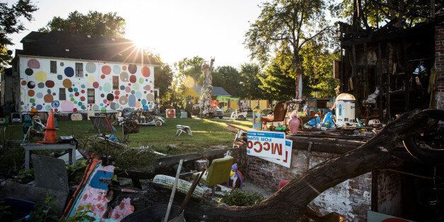 DETROIT, MI - SEPTEMBER 03: An art instillation created amongst the ruins of a partially burned-down home sits amongst the 'Heidelberg project,' which is an 'open air art environment' centered around one block in Detroit, on September 3, 2013 in Detroit, Michigan. The Heidelberg project is the brain child of Tyree Guyton. He and other artists use the urban environment (including homes and sidewalks) as a canvas for art, which they make using paint and recycled materials. (Photo by Andrew Burton/Getty Images)