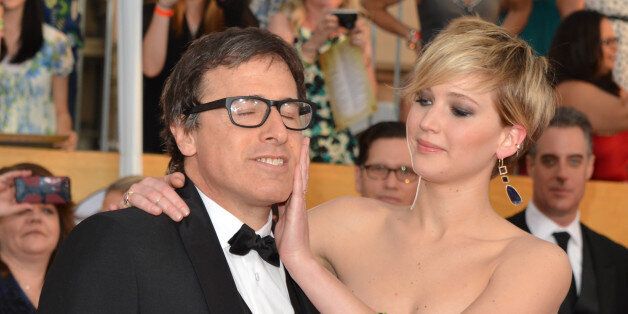LOS ANGELES, CA - JANUARY 18: Director David O. Russell (L) and actress Jennifer Lawrence attend the 20th Annual Screen Actors Guild Awards at The Shrine Auditorium on January 18, 2014 in Los Angeles, California. (Photo by Lester Cohen/WireImage)