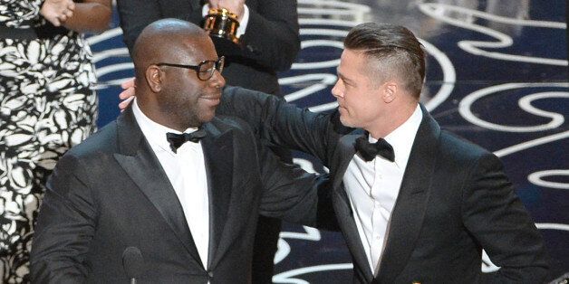 HOLLYWOOD, CA - MARCH 02: Director Steve McQueen (L) and actor/producer Brad Pitt accept the Best Picture award for '12 Years a Slave' onstage during the Oscars at the Dolby Theatre on March 2, 2014 in Hollywood, California. (Photo by Kevin Winter/Getty Images)