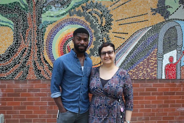 Sebastian Commock stands with his colleague Forouz Salari outside The 519 in Toronto.