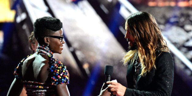 LOS ANGELES, CA - APRIL 13: Actor Jared Leto (R) accepts the Best On-Screen Transformation award for 'Dallas Buyers Club' from actress Lupita Nyong'o onstage at the 2014 MTV Movie Awards at Nokia Theatre L.A. Live on April 13, 2014 in Los Angeles, California. (Photo by Kevin Mazur/WireImage)