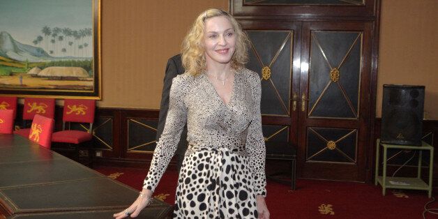 US singer Madonna is seen at State House in Lillongwe Malawi, Friday, Nov, 28, 2014, during her meeting with the Malawian President Peter Mutharika at State House. Mutharika thanked Madonna for agreeing to fund the construction of a new state of the art Paediatric Surgery and Intensive Care Unit in the country. Madonna is currently visiting Malawi, where she has been working since 2006 with her nonprofit organisation, Raising Malawi. ( AP Photo/Tsvangirayi Mukwazhi)