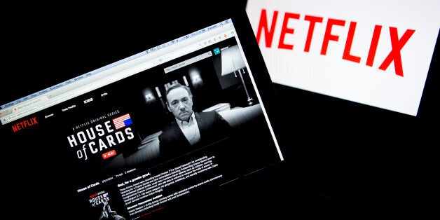 The Netflix Inc. website displays the 'House of Cards' series on a laptop computer in this arranged photograph in Washington,