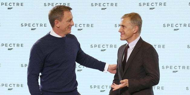 Actors from left, Daniel Craig and Christoph Waltz greet one another before they pose for photographers at the announcement