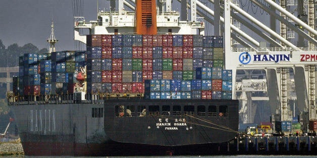 ** ADVANCE FOR SUNDAY, JUNE 30 ** A container ship is unloaded at the Port of Oakland in Oakland, Calif., Tuesday, June 25, 2