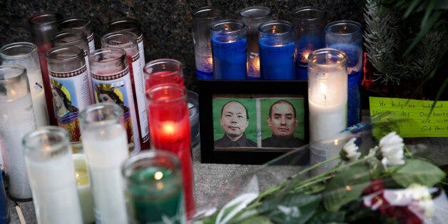 NEW YORK, NY - DECEMBER 22: A view of a memorial for slain NYPD officers, Wenjian Liu and Rafael Ramos, outside a police stat