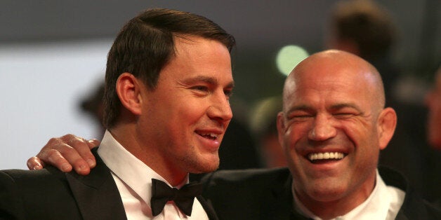 Channing Tatum and Mark Schultz depart the screening of Foxcatcher at the 67th international film festival, Cannes, southern France, Monday, May 19, 2014. (Photo by Joel Ryan/Invision/AP)