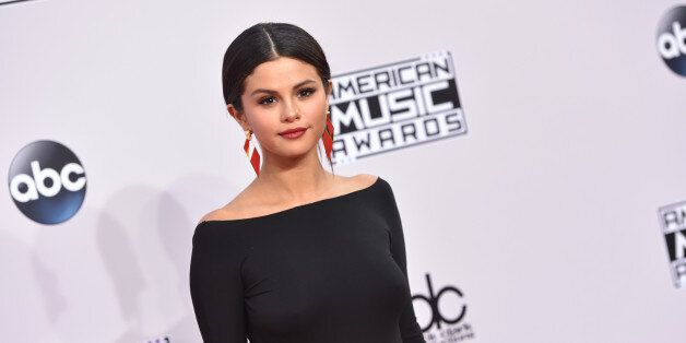 Selena Gomez arrives at the 42nd annual American Music Awards at Nokia Theatre L.A. Live on Sunday, Nov. 23, 2014, in Los Angeles. (Photo by John Shearer/Invision/AP)