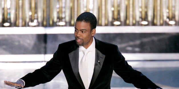 **EMBARGOED AT THE REQUEST OF THE MOTION PICTURE ACADEMY FOR USE UPON CONCLUSION OF THE ACADEMY AWARDS TELECAST** Oscar Host Chris Rock performs his monologue to open the 77th Academy Awards telecast Sunday, Feb. 27, 2005, in Los Angeles. (AP Photo/Mark J. Terrill)