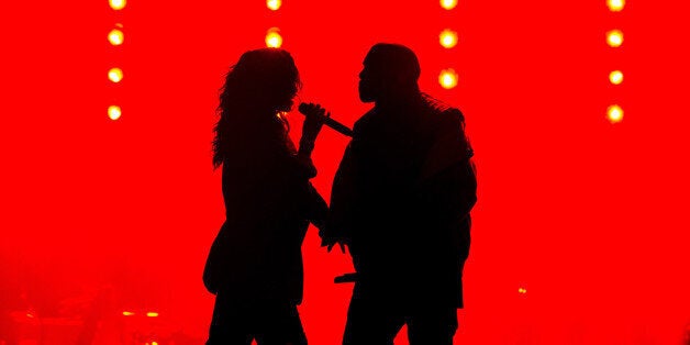 GLENDALE, AZ - JANUARY 31: Recording artists Kanye West (R) and Rihanna perform onstage during DirecTV Super Saturday Night hosted by Mark Cuban's AXS TV and Pro Football Hall of Famer Michael Strahan at Pendergast Family Farm on January 31, 2015 in Glendale, Arizona. (Photo by Christopher Polk/Getty Images for DirecTV)