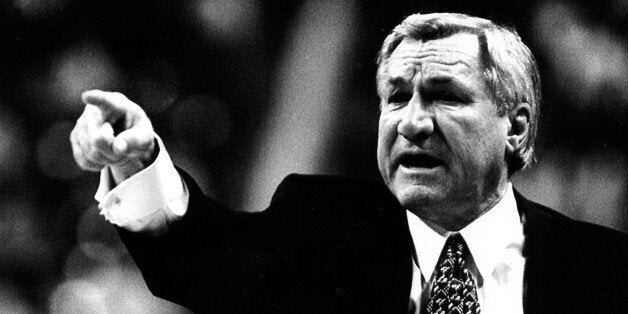 CIRCA 1990: Dean Smith, head coach of the University of North Carolina, points to the basketball court. (Photo by North Carol