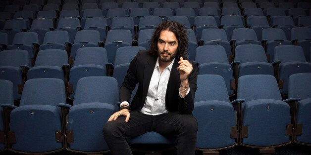 LONDON, ENGLAND - NOVEMBER 25: Russell Brand poses for photographs as he arrives to deliver The Reading Agency Lecture at The Institute of Education on November 25, 2014 in London, England. Russell Brand will deliver 'a manifesto on reading' which will be in part personal, sharing his own experience of books and reading while growing up in the UK. (Photo by Carl Court/Getty Images)