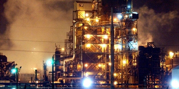 FILE - In this March 25, 2005 file photo, steam released from the BP oil refinery floats across part of the plant in Texas City, Texas. The Occupational Safety and Health Administration on Friday, Oct. 30, 2009, issued a record $87 million fine against oil giant BP PLC for failing to correct safety hazards after a 2005 explosion killed 15 workers and injured 170 at its Texas City refinery.(AP Photo/Tony Gutierrez, file)