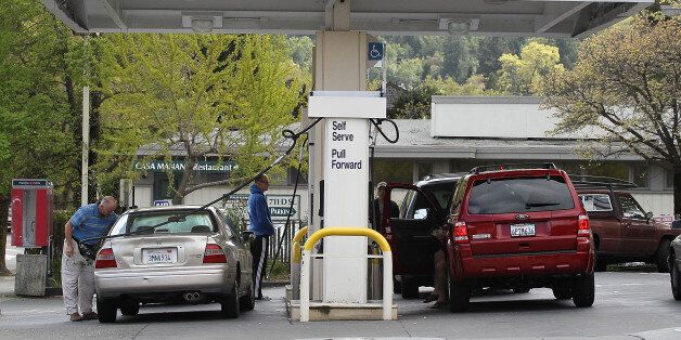 SAN RAFAEL, CA - APRIL 11: Customers pump gas into their cars at an Arco gas station on April 11, 2011 in San Rafael, California. Gas prices continue to surge across the United States with the national average for a gallon of regular unleaded gasoline at $3.79 compared to $3.68 last week and $3.19 in late February. (Photo by Justin Sullivan/Getty Images)