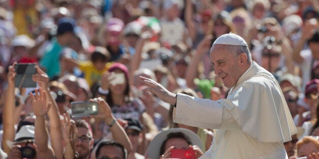 Pope Francis arrives for his weekly general audience in St. Peter's Square at the Vatican, Wednesday, Aug. 26, 2015. (AP Phot