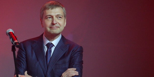 Russian businessman and President of AS Monaco football club, Dmitry Rybolovlev poses during the celebration of the AS Monaco 2012-13 season and their come back in the French Premier League football for the next season, Friday, May 31, 2013, in Monaco. (AP Photo/Lionel Cironneau)