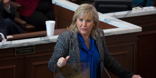 Oklahoma Gov. Mary Fallin proposes increasing the cigarette tax and expanding the sales tax to a variety of services that are currently exempt as a way to close an estimated $900 million hole in next year's budget during her State of the State address, Monday, Feb. 1, 2016 in Oklahoma City. (AP Photo/J Pat Carter)