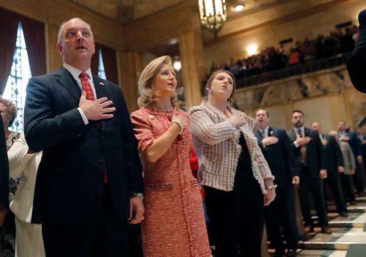 Louisiana Gov. John Bel Edwards with his wife, Donna Edwards, and their daughter Sarah Ellen Edwards during the pledge of allegiance April 8 at the opening of the annual state legislative session in Baton Rouge.
