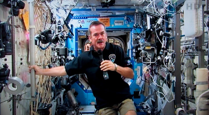 Canadian astronaut Chris Hadfield responds to a question during a news conference from the International Space Station on Jan. 10, 2013.