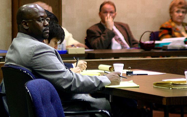 Curtis Flowers (left) listens to testimony in his third capital murder trial in Winona, Mississippi, on Feb. 6, 2004.