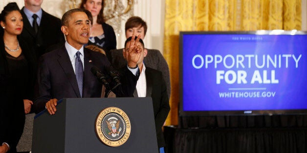 U.S. President Barack Obama talks before signing a Presidential Memorandum on modernizing the overtime system to help insure workers are paid fairly for their work while in the East Room of the White House in Washington, March 13, 2014. REUTERS/Larry Downing (UNITED STATES - Tags: POLITICS)