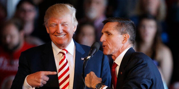 GRAND JUNCTION, CO - OCTOBER 18: Republican presidential candidate Donald Trump (L) jokes with retired Gen. Michael Flynn as they speak at a rally at Grand Junction Regional Airport on October 18, 2016 in Grand Junction Colorado. Trump is on his way to Las Vegas for the third and final presidential debate against Democratic rival Hillary Clinton. (Photo by George Frey/Getty Images)