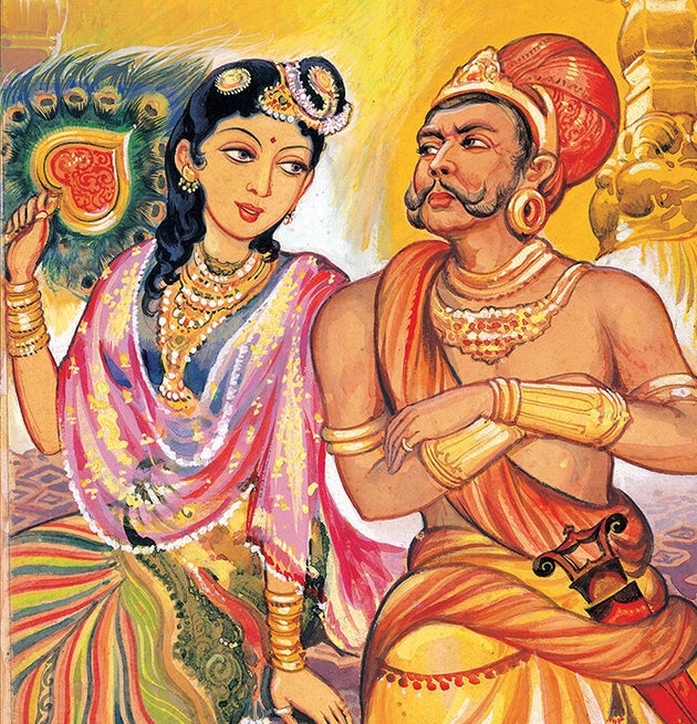 Maniam (in black and white) and Maniam Selvan (R) holding a