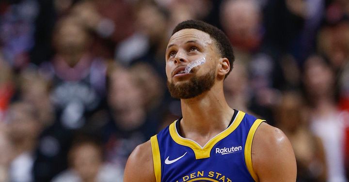 Golden Star Warriors player Steph Curry chews on his mouthguard during the 2019 NBA Finals.