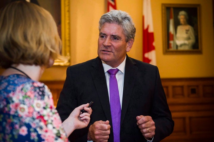 Interim Liberal leader John Fraser speaks to a reporter in the lobby at Queen's Park in Toronto on July 11, 2018. 