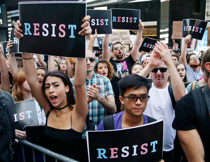 Demonstrators rally in New York's Times Square on July 26, 2017, to protest Trump's announcement of a ban on transgender troo