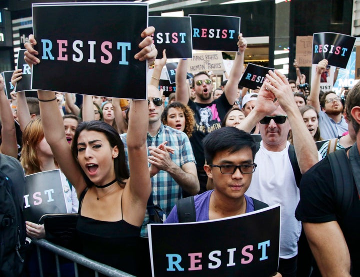 Demonstrators rally in New York's Times Square on July 26, 2017, to protest Trump's announcement of a ban on transgender troops serving in the military.