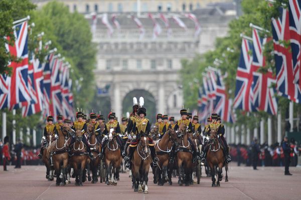 Members of the King's Troop Royal Artillery lead the parade down the Mall back to Buckingham Palace after the queen's birthda